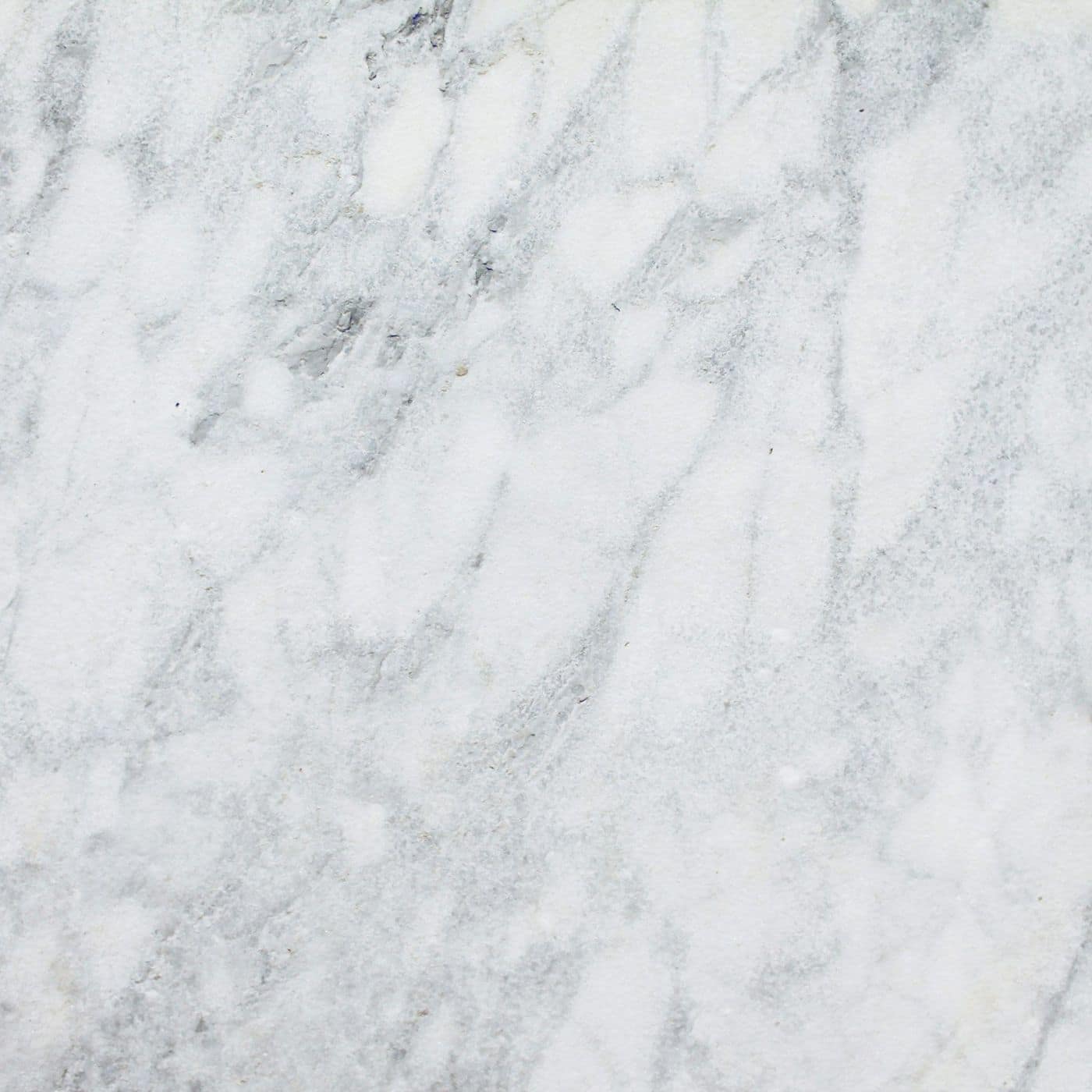 Close-up of white marble surface with soft grey veining