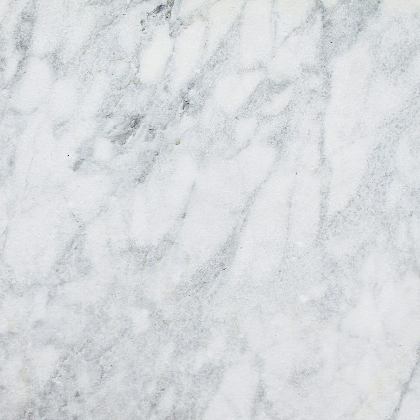 Close-up of white marble surface with soft grey veining